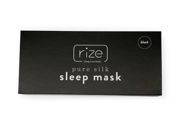 Overhead View Of Black Packaging Of Rize Home Silk Sleep Mask