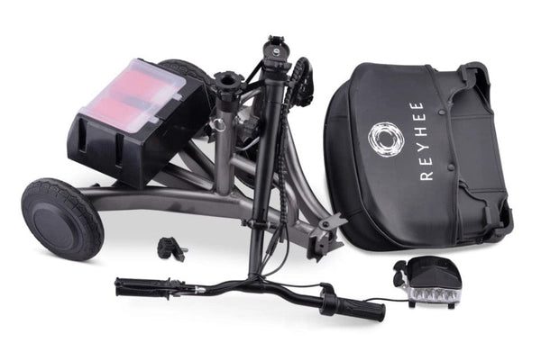 Overhead View Of The Reyhee Triad Compact Folding Electric Mobility Scooter With The Gun Metal Colored Frame Shown In The Folded Disassembled Position