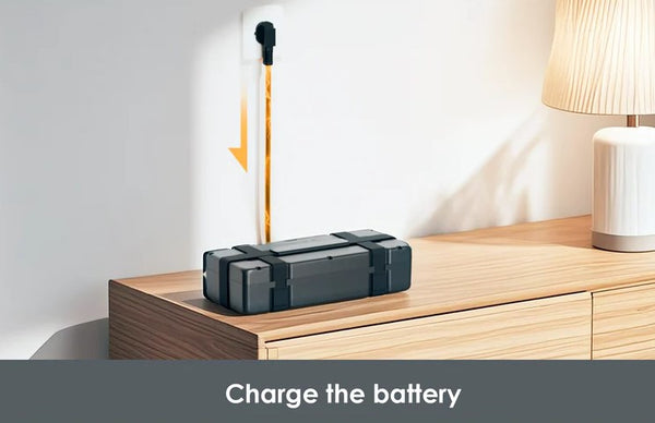 Paiseec S3 Mobility Scooter Battery Pack On A Wooden Surface With A Lamp In The Background