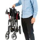 Person Holding The Feather Electric Wheelchair In The Folded Position