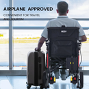 Rear Centered View Of The Metro Mobility iTravel Lite Lightweight Electric Wheelchair Shown With A Man Sitting In The Chair Holding A Suitcase In An Airport Setting With Text Airline Approved And Convenient For Travel And Tourism