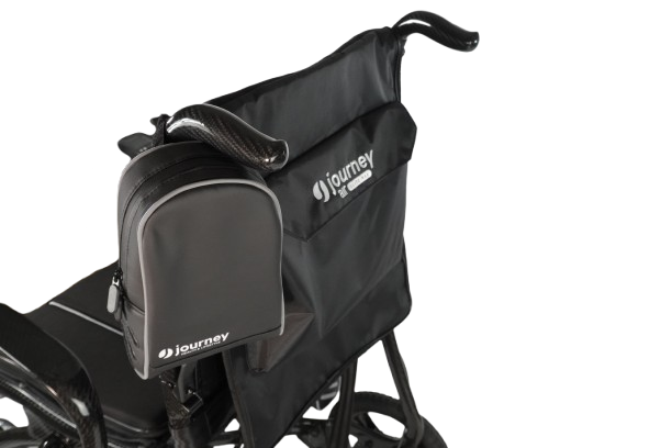 Rear Left Side View Of The Journey Air Elite Max Carbon Fiber Electric Wheelchair Shown With Battery Carry Pouch