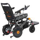Rear Right View Of The Bangeran Pegasus Kids Pediatric Electric Wheelchair Shown In Black And Orange Color