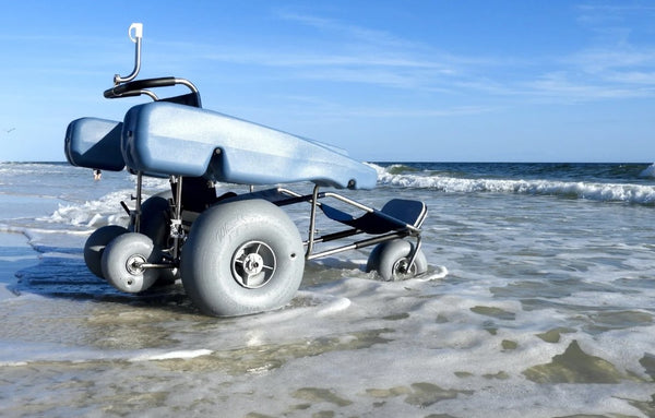 Rear Right View Of The Debug Mobility EZ Roller Floating Beach Chair In A Beach Setting
