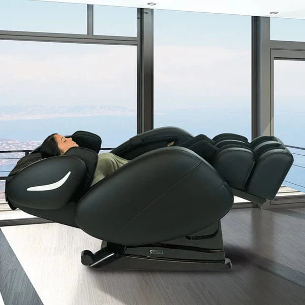 Right Side View Of A Woman Laying In The Infinity Smart Chair X3 3D/4D Massage Chair In The Zero Gravity Position Shown In Black Color In An Indoor Setting