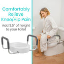 Right Side View Of A Woman Sitting On The Vive Health Toilet Seat Riser With Handles In A Bathroom Setting With Text 'Comfortably Relieve Knee/Hip Pain' And 'Add 3.5" Of Height To Your Toilet'