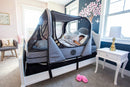 Right Side View Of The Abram's Nation Safety Sleeper 200 Model Shown With Heather Grey Color In An Indoor Setting With Child Sleeping 