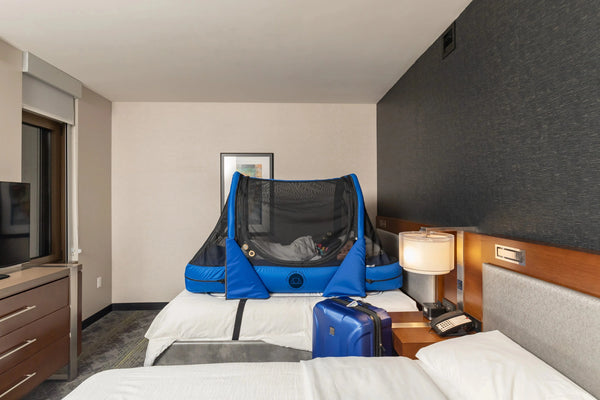 Right Side View Of The Abram's Nation Safety Sleeper 200 Model Shown With Sail Blue Color In A Hotel Room