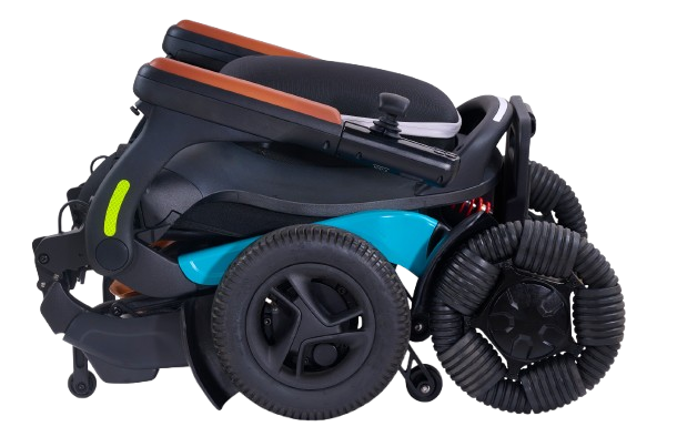 Right Side View Of The Golden Technologies Ally Pro Omnidirectional Electric Wheelchair Shown In Teal Color And In The Folded Position