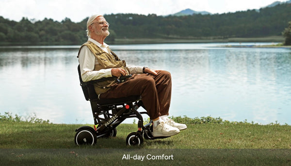 Right Side View Of The Paiseec Q3 Lightweight Electric Wheelchair With Elderly Man Sitting In The Chair In An Outdoor Setting