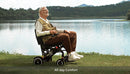 Right Side View Of The Paiseec Q3 Lightweight Electric Wheelchair With Elderly Man Sitting In The Chair In An Outdoor Setting