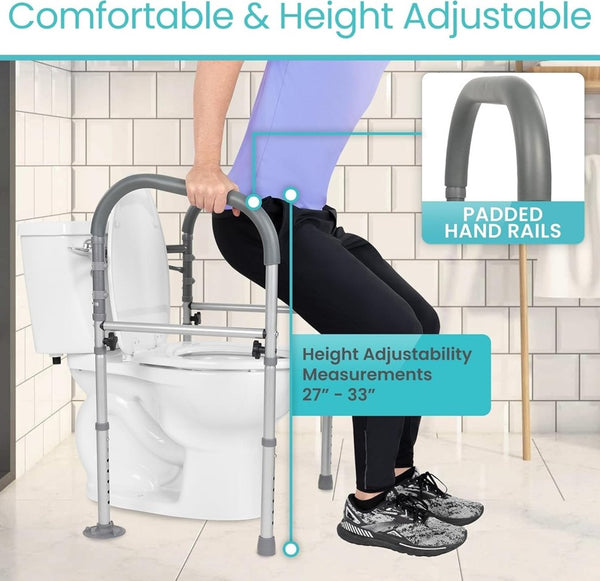 Right Side View Of The Vive Health Toilet Safety Frame With Handles With A Person Using The Railing To Stand Up Over A Toilet In A Bathroom Setting With Text 'Comfortable & Height Adjustable'.