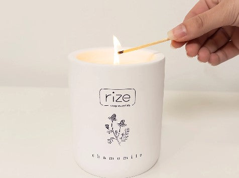 Rize Home Essential Oil Chamomile Candle Being Lit With A Match