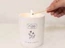 Rize Home Essential Oil Chamomile Candle Being Lit With A Match