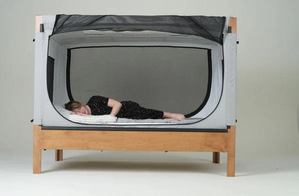 Safe Place Bedding Model 200 Brown Finish With Gray Colored Cover Side View Woman Laying Down