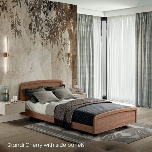 Side View Of The Accora Empresa 12-Function Hi Low Adjusting Nursing Bed Shown In Skandi Design With Cherry Wood Finish In A Homecare Setting