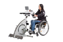 Side View Of A Woman In A Wheelchair Using The Kinetec Kinevia Duo Active Passive Trainer 