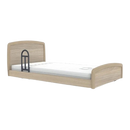 Side View Of The Accora Empresa 12-Function Hi-Low Adjusting Nursing Bed Shown In Skandi Design With One Assist Rail And Oak Wood Finish