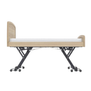 Side View Of The Accora Empresa 12-Function Hi-Low Adjusting Nursing Bed Shown In Skandi Design In The Elevated Height Position And Oak Wood Finish