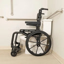 Side View Of The ActiveAid SC Self-Propelled Shower Commode Chair Shown With Black Frame And In A Bathroom Setting