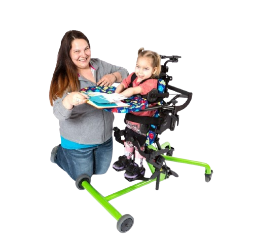 Side View Of The EasyStand Bantam Small Standing Frame Shown In Green Color With Child In Stander And Woman Kneeling Next To Her