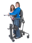 Side View Of The EasyStand Evolv Large Shown With A Woman Using The Stander And Another Woman Standing Next To Her