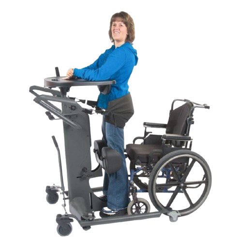 Side View Of The EasyStand StrapStand Standing Frame Shown With Woman Using The StrapStand From A Wheelchair