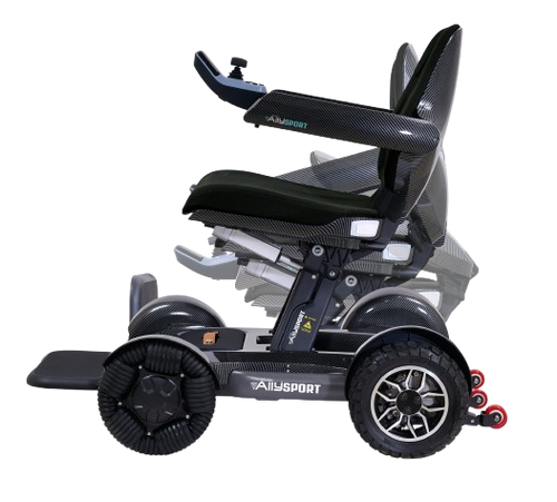 Side View Of The Golden Technologies Ally Sport Omnidirectional Electric Wheelchair Shown In Carbon Fiber Color Demonstrating Its Folding Capability