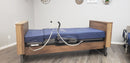 Side View Of The Med Mizer Active Care Deluxe Rotating Bed And Bed In A Home Setting