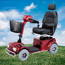 Side View Of The Merits Pioneer 4 Mobility Scooter With A Grassy Background