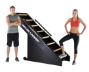 Side View Of The StairMaster Jacob's Ladder Stair Climber Shown With A Woman And A Man Standing Beside The Climber