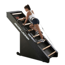 Side View Of The StairMaster Jacob's Ladder Stair Climber Shown With An In Shape Woman In Shorts And White Shirt Operating The Climber