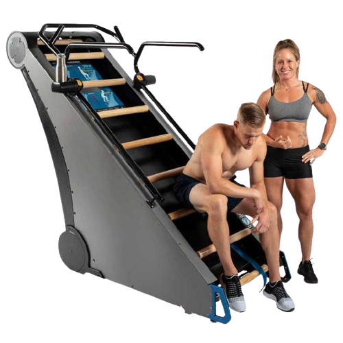 Side View Of The StairMaster Jacob's Ladder X Stair Climber Shown With A Woman Standing And A Man Sitting On The Climber