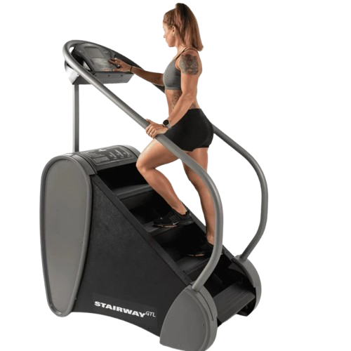 Side View Of The StairMaster Stairway GTL Stair Climber Shown With A Woman Operating The Climber