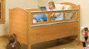 Sleep Safe Basic Bed Side View Oak Finish No Padding Young Girl Reading