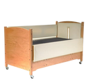 Sleep Safe Low Bed Side View Wood With Cream Padding And Center Medical Tubing Cut Out At Headboard