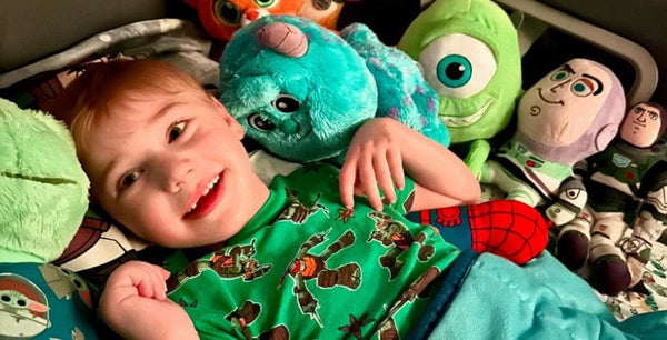 Sleep Safe Tall Bed Child Laying Down Smiling