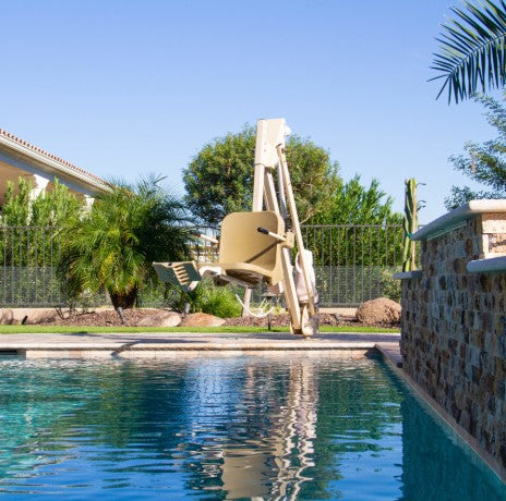 Swimming Pool With An Aqua Creek Mighty 400 Pool Lift Tan And White Color Front View On A Sunny Day