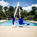 Swimming Pool With An Aqua Creek Revolution XL Pool Lift Blue And White Color Front View On A Sunny Day.