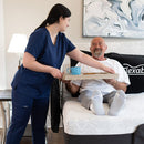 The Flexabed Hi Low Adjustable Bed Front Facing View With Side Rails And Side Rail Covers With Caregiver And Patient