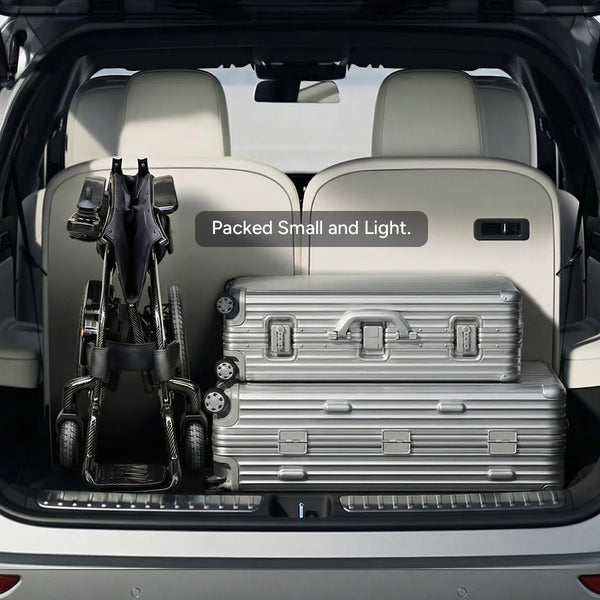 Trunk Of A Vehicle With Suitcases And The Paiseec Q5 Carbon Fiber Electric Wheelchair, Labeled 'Packed Small and Light'.