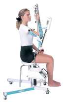 Woman In The Seated Position Side View Using The Kinetec 6080 Elbow CPM Machine