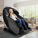 Woman Using The Infinity Imperial Syner-D Massage Chair Shown In Black/Black Color In A Modern Living Room
