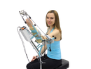 Woman Wearing Tights And Blue Tank Top In The Seated Position Front View Using The Kinetec 6080 Elbow CPM Machine 