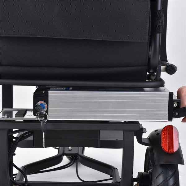 Close Up Rear View Of The Lithium Battery Being Removed From The MotoTec Folding Mobility Electric Trike 48v 700w Dual Motor Lithium