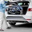 Close Up View Of A Person Loading The Strongback 24 +AB Ultra-Lightweight Wheelchair In The Trunk Of A Car