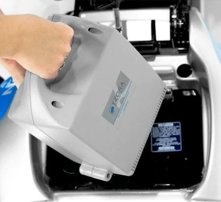 Close Up View Of A Person Removing The Batteries For The Tzora Titan 4 Hummer Medical Mobility Scooter