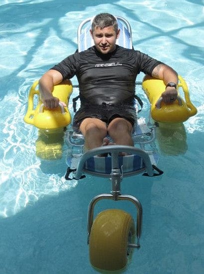 Front View Of The AccessRec WaterWheels Floating Beach Wheelchair Shown With Man Floating In Chair In A Pool Setting
