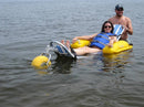 Front View Of The AccessRec WaterWheels Floating Beach Wheelchair Shown With Woman Laying Down In The Chair With Man Standing Behind Her In A Water Setting