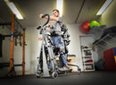 Front View Of The EasyStand Glider Large Active Standing Frame Shown With Man Using Device In A Gym Setting